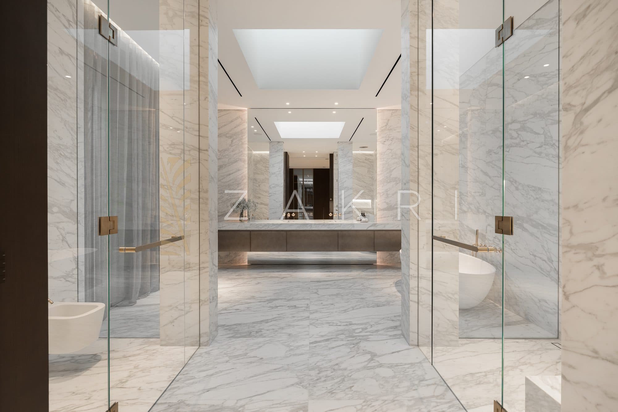 A principal bathroom in book-matched marble