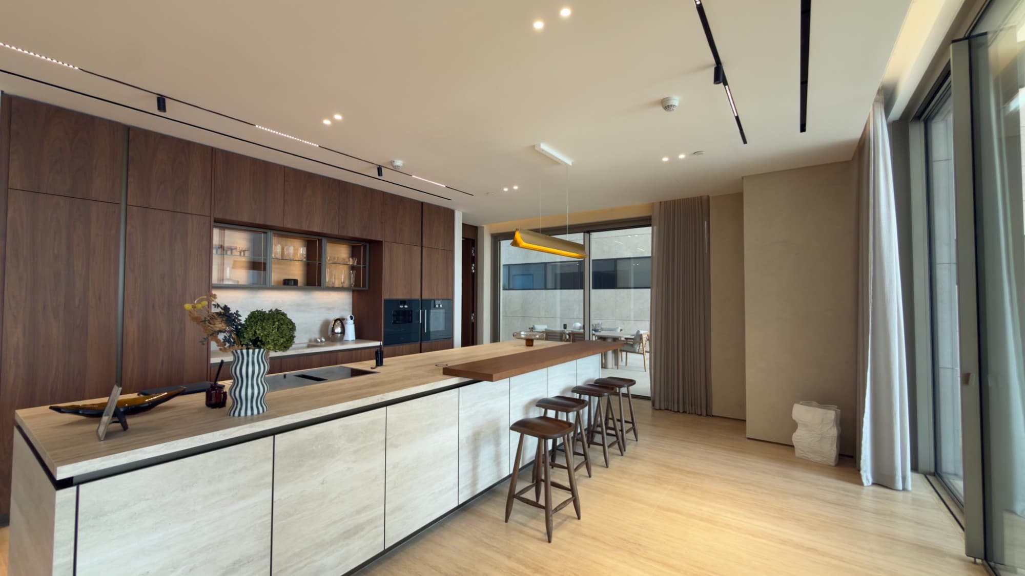 The Molteni show kitchen and its island, with seating along the counter