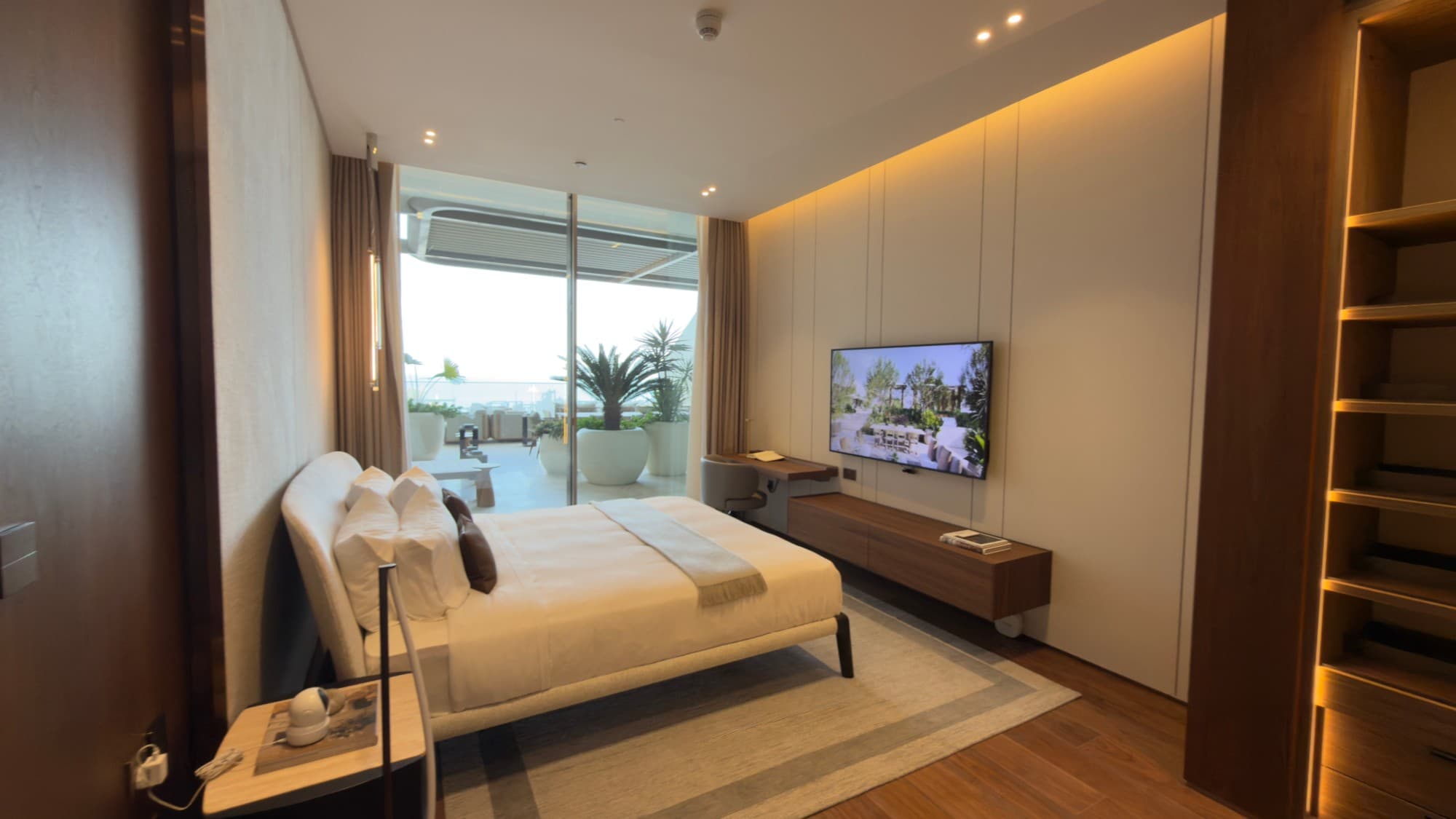 A further bedroom, with the planted terrace outside it